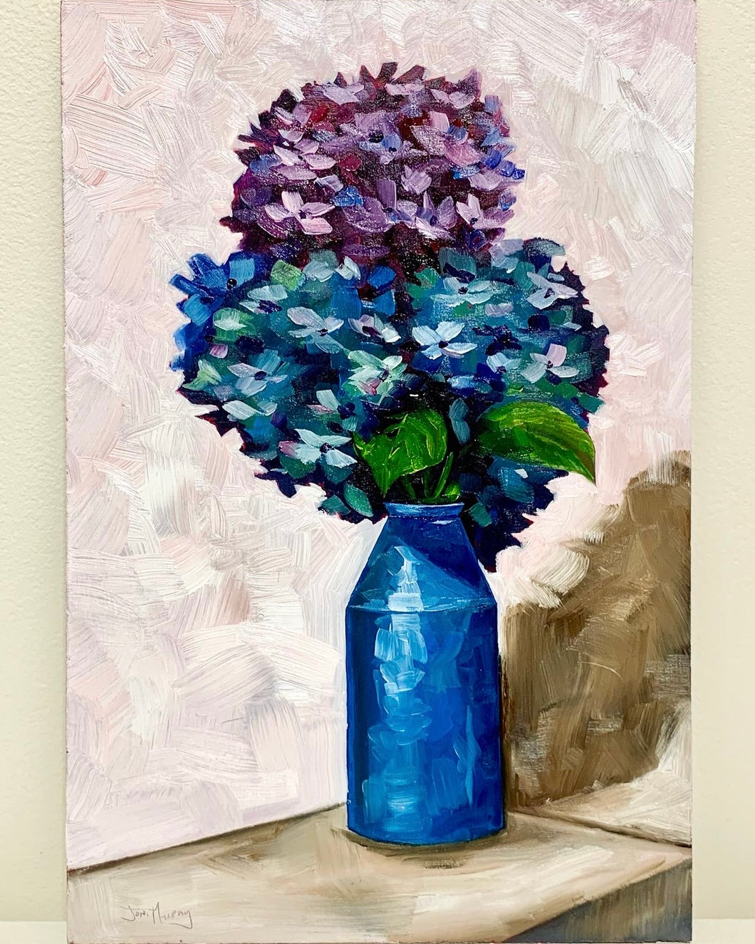 Hydrangeas in a blue bottle